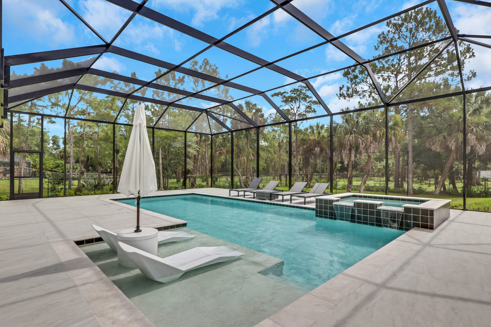 Finished pool and spa with screened lanai — 634 19th St SW