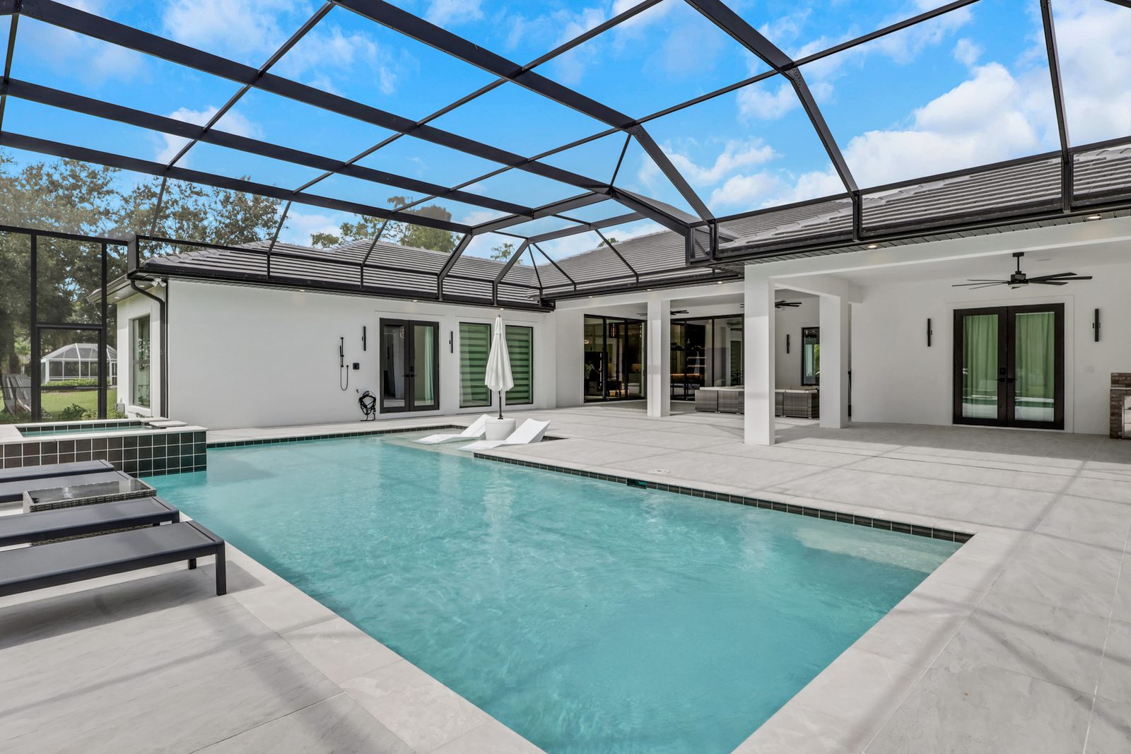 Screened lanai and pool deck on a Southwest Florida custom home