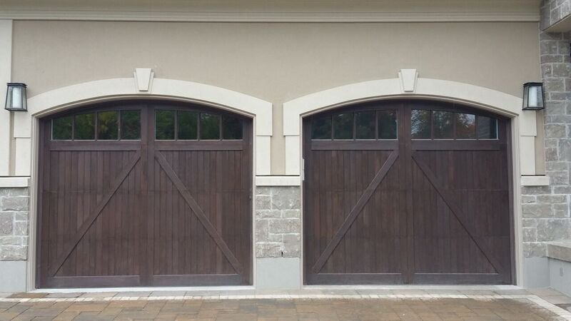 Walnut-toned stained wood garage doors